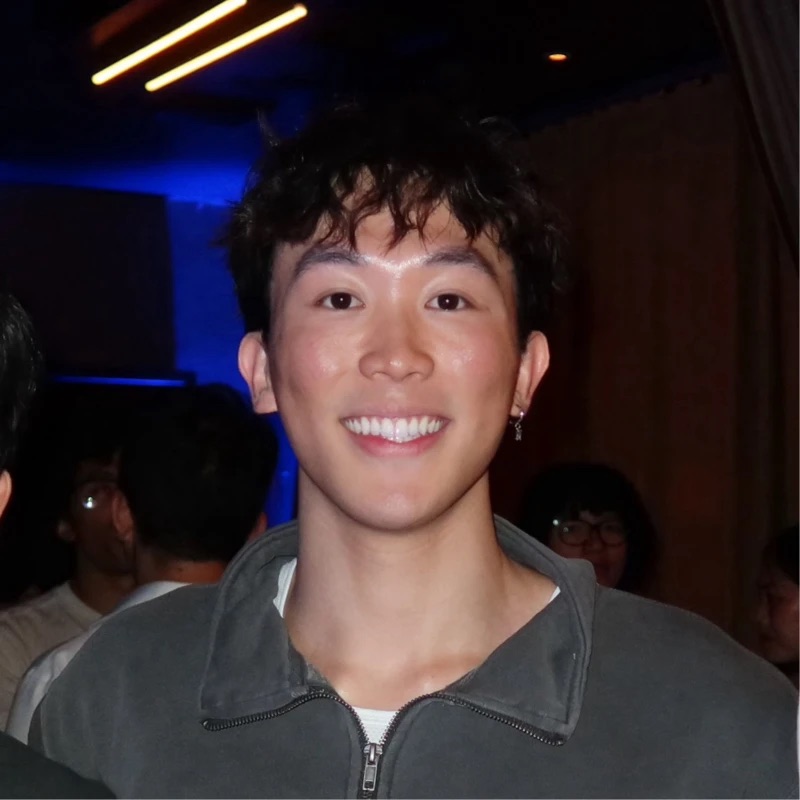 Leo, smiling, at an event